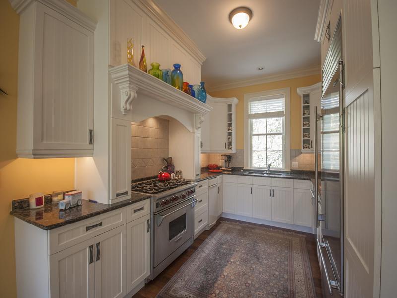 Gourmet kitchen adjacent to dining room and laundry