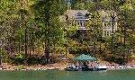 Crescent Communities on Lake Keowee custom home with private boathouse overlooks Lake Keowee.