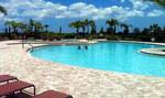 Resort-style swimming pool with a spa and resistance lap pool at River Strand Golf & Country Club