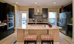 Standard finishes include granite kitchen countertops with the option to upgrade to stainless steel appliances, as shown in the Stuart model at MetroWest.