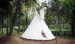 The youngest residents of Equestrian Lakes enjoy the playground with a log cabin fort, teepee and fire pit.