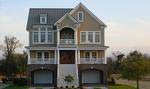 This new home in Cannonsgate at Bogue Sound features detailed exterior design and inviting porches