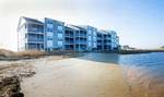 Overlooking the Indian River Bay, Bethany Bay’s private sandy beach provides a perfect venue for family picnics.