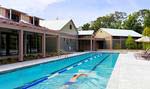 View of the heated lap pool, located near the zero-entry family pool at Spring Island's Sports Complex.