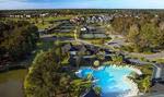 Daniel Island Club’s swim, tennis and fitness facility offers members two-resort-style swimming pools, a state-of-the-art fitness center, and 11 tennis courts.
