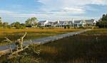 Set against beautiful golf, marsh and creek views, the clubhouse at the Daniel Island Club offers a casually elegant setting.
