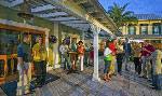 Residents gather for sunset happy hours at The Outfitters.