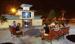 With a fireplace and plasma screen TV, the Park Square Outdoor Living Room is ideal for socializing or viewing television under the stars.