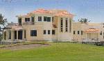 A new house abutting the golf course at Estrella Del Mar