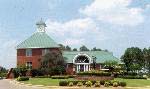 Anderson Creek Club's Clubhouse with the Sales Center, Dining Car Bar & Grill, Library, Pro shop and Fitness room. Fine dining and entertainment weekly.