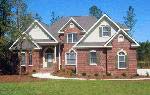 Custom home in the Founder’s Club neighborhood at Anderson Creek Club, overlooking one of the many ponds.