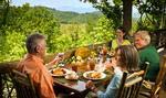 The Boarding House Restaurant features a large outdoor seating area with beautiful views.