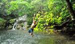 Try your hand on the rope swing at the Blue Hole in Blue Ridge Mountain Club