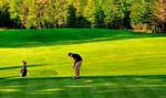 Putting out on the 6th hole