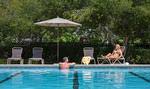 Residents sunbathing at the Harbor Club pool.