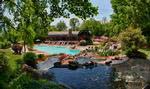 Incredible mountain scenery and a striking water feature surround Linville Ridge’s heated mountainside swimming pool.