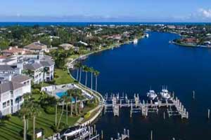 The Moorings in Vero Beach, Florida - This master-planned Treasure Coast community features an expansive private ocean beach, a Pete Dye golf course, a full-service marina and a clubhouse harboring a full complement of recreational amenities. Lots are priced from $995,000, with condos from $249,000 to $875,000 and single-family homes from $1 million to over $5.2 million.